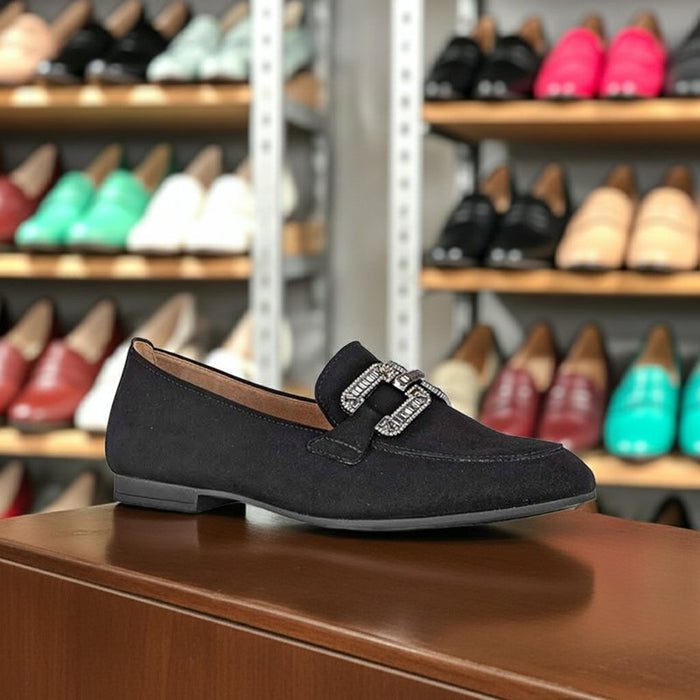 Front black leather loafer with square metal buckle and moc toe stitching