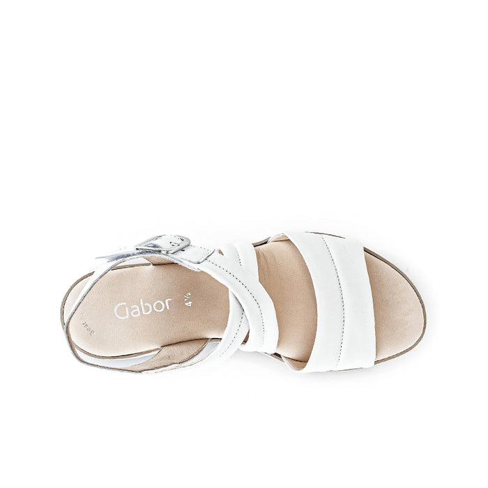 White leather sandal with open toe, wide strap, and side strap detail