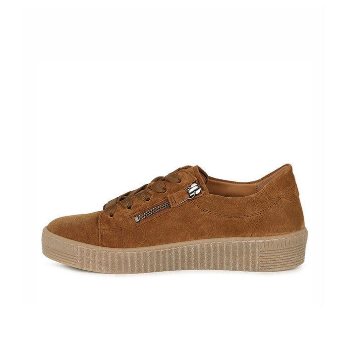 Brown suede sneakers with front zipper and lace-up design on a platform sole.