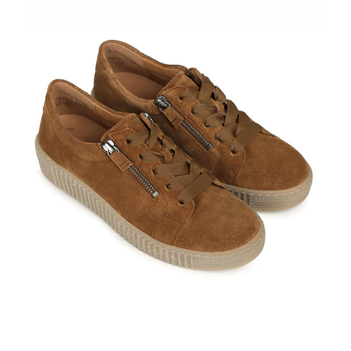 Brown suede low-top sneakers with double zip pull and lace-up closure.