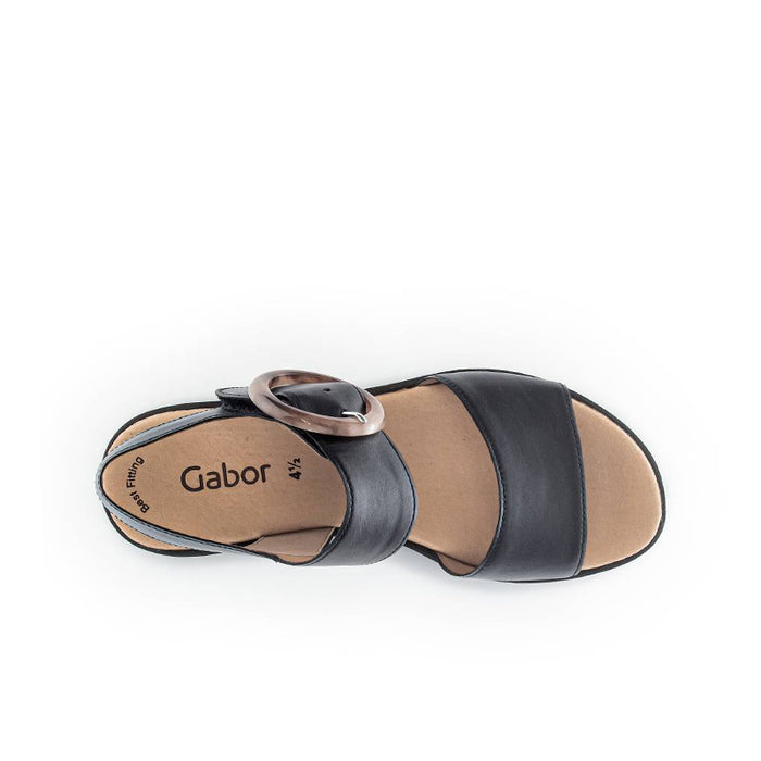 Black open-toe platform sandal with ankle strap and tan interior lining