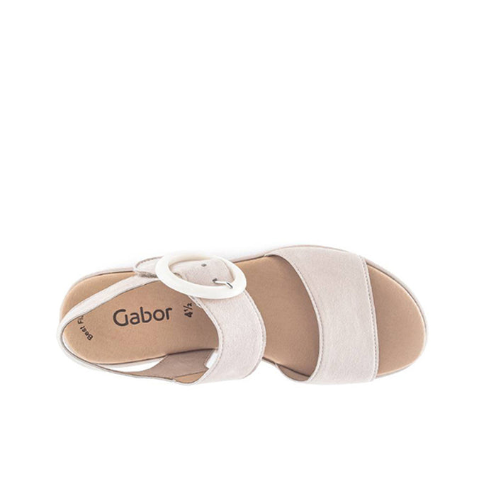 Light beige platform sandals with open toe, ankle strap, and round buckle