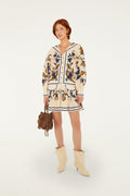 FARM Rio model wearing the Golden Nature Long Sleeve Mini Dress
