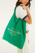 FARM Rio model wearing the Green Together We Play Tote Bag