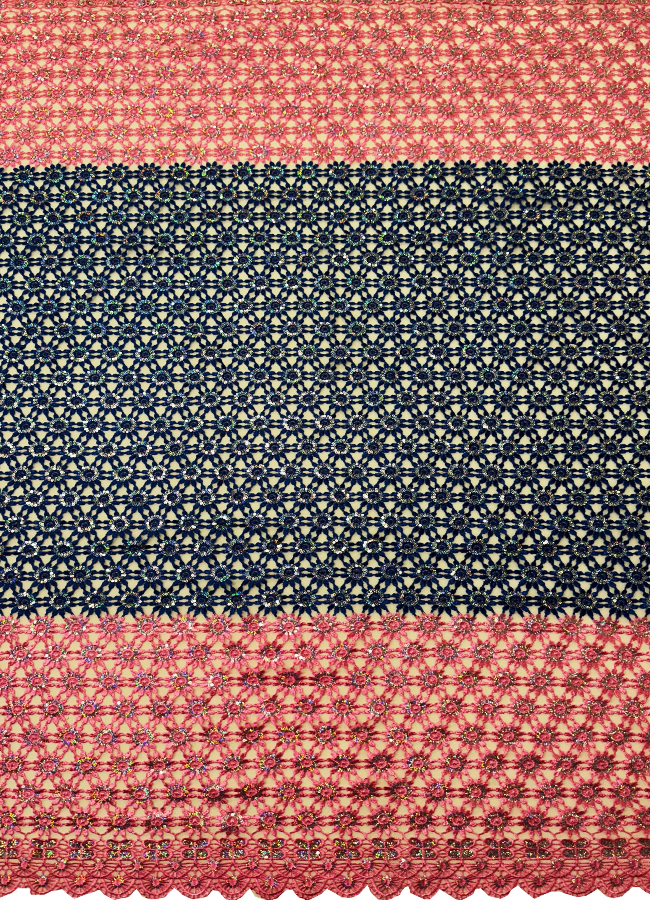A piece of Guipure Lace featuring a pink and blue pattern with white sequins.