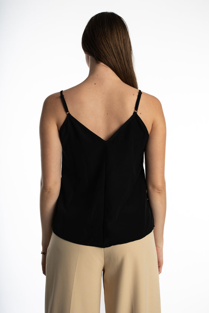 Back view of Hallie black lace tank top featuring a chic V-back and adjustable spaghetti straps on a model.