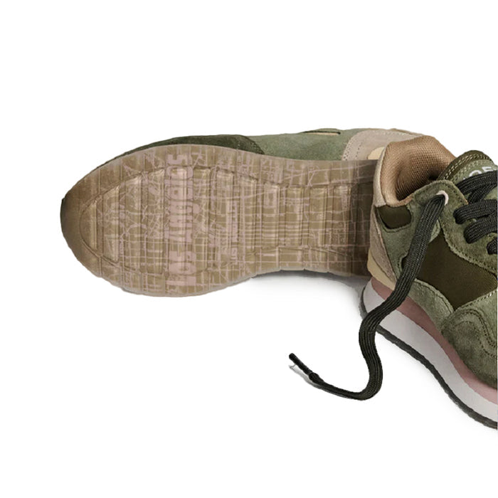 Green sneaker outsole and heel detail with lace-up upper