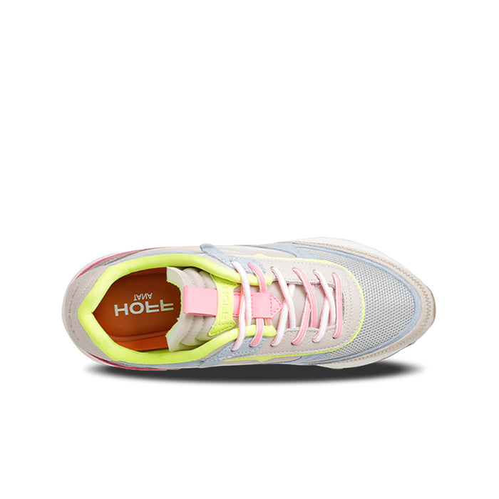 Women's sneaker close-up: multicolor lace-up with neon lining and cushioned collar