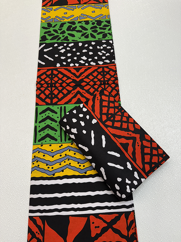 Colorful patterned fabric with geometric designs on a white background