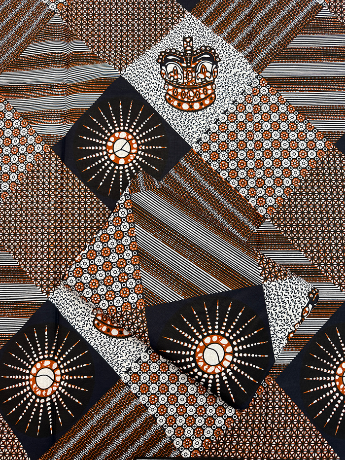 Hollandais Wax Print Fabric with geometric designs in brown, white, and black on a white background