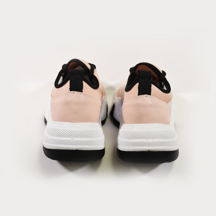 Heel view of Ice Chunky Platform Sneakers in blush pink and white with black trim and thick streetwear soles.