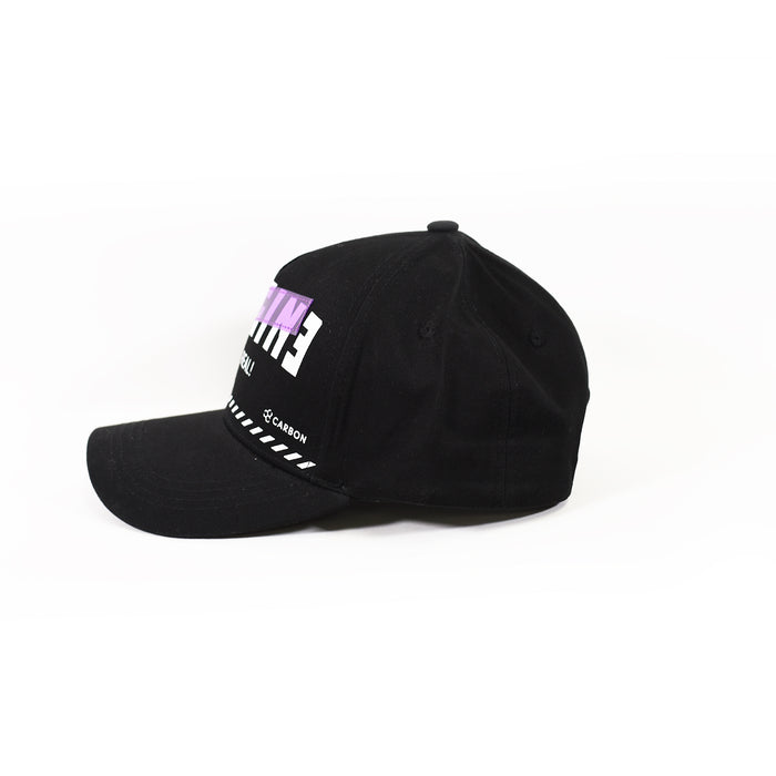 Side view of IMAGIN black streetwear snapback hat in Carbon with purple embroidered patch and white graphic details.
