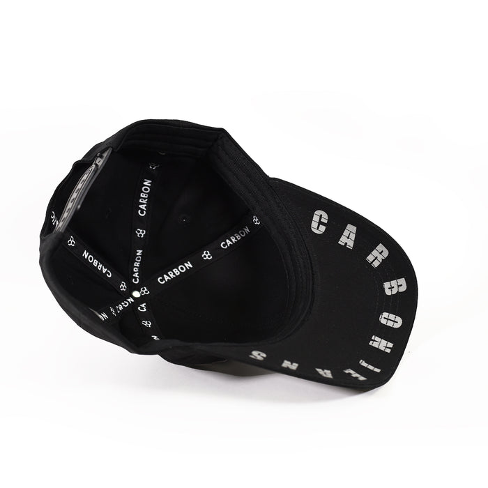 Interior view of IMAGIN black streetwear hat featuring branded Carbon taping and silver embroidered brim graphics.