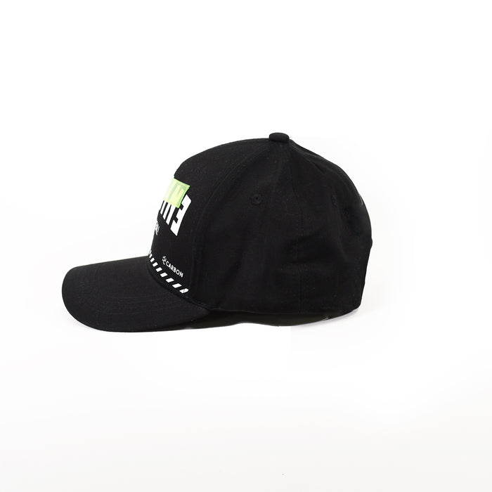 Side profile of IMAGIN black streetwear snapback hat with neon green and white embroidery on a white background.