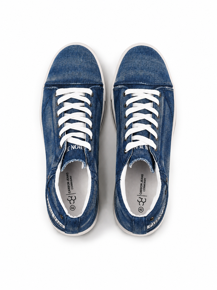 Blue denim sneakers with white laces and a casual design, featuring a low-top silhouette and rubber soles.