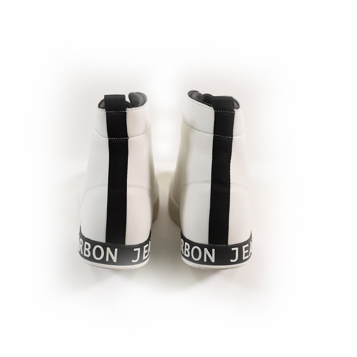 Rear view of Jimmy white high-top streetwear sneakers with black heel stripes and Carbon branding on the sole.