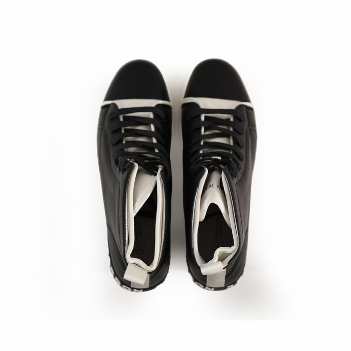 Top-down view of Jimmy Urban Streetwear Sneakers in Carbon black and white leather with high-top collars and black laces.