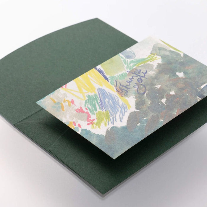 Colorful card with 'Thank you' inside a green envelope on a white background