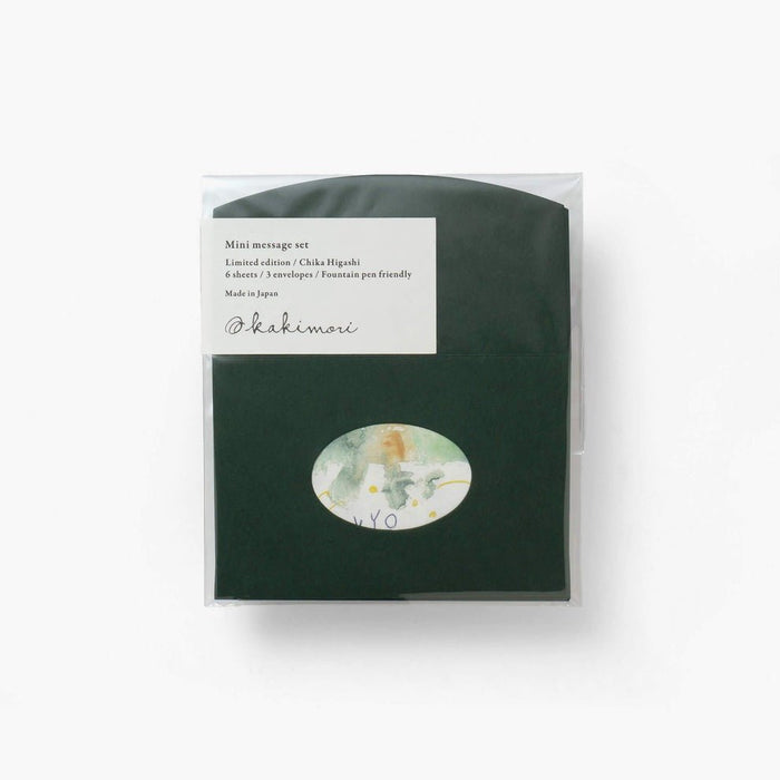 Packaged product with a green cover and white label on a white background