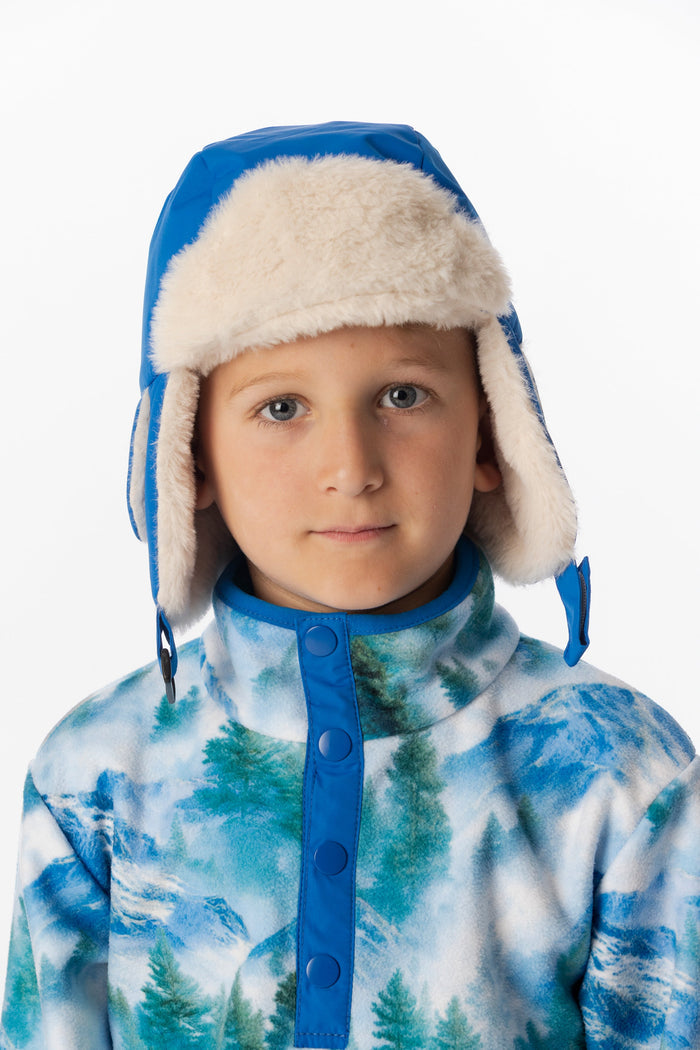 Child wearing the Deux par Deux blue lined chapka, lookbook view