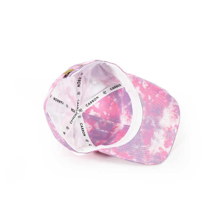 Interior of Carbon Tie-Dye Baseball Cap featuring pink and purple patterns with branded logo inner tape.