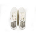 Top view of Carbon Urban Signature Logo Sneakers in white with gold hardware and lace-up streetwear design.