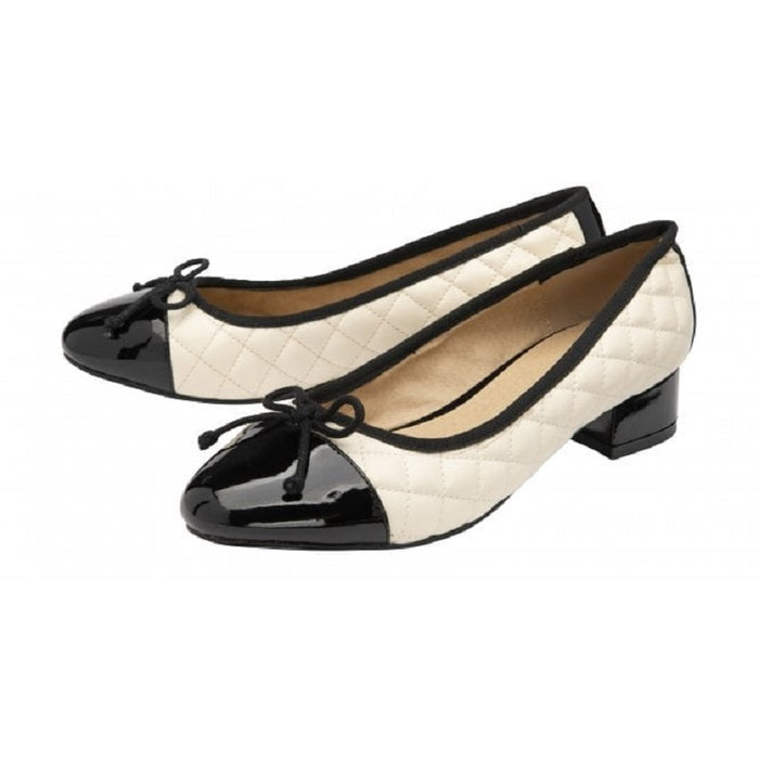 Women’s cream pumps with black patent toe cap, bow ties, low block heel