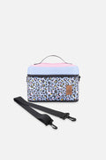 Deux par Deux insulated lunch box in blue leopard print, front view
