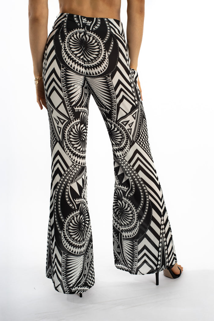Rear view of Marlee high-waisted wide leg pants in a bold black and white geometric tribal print.