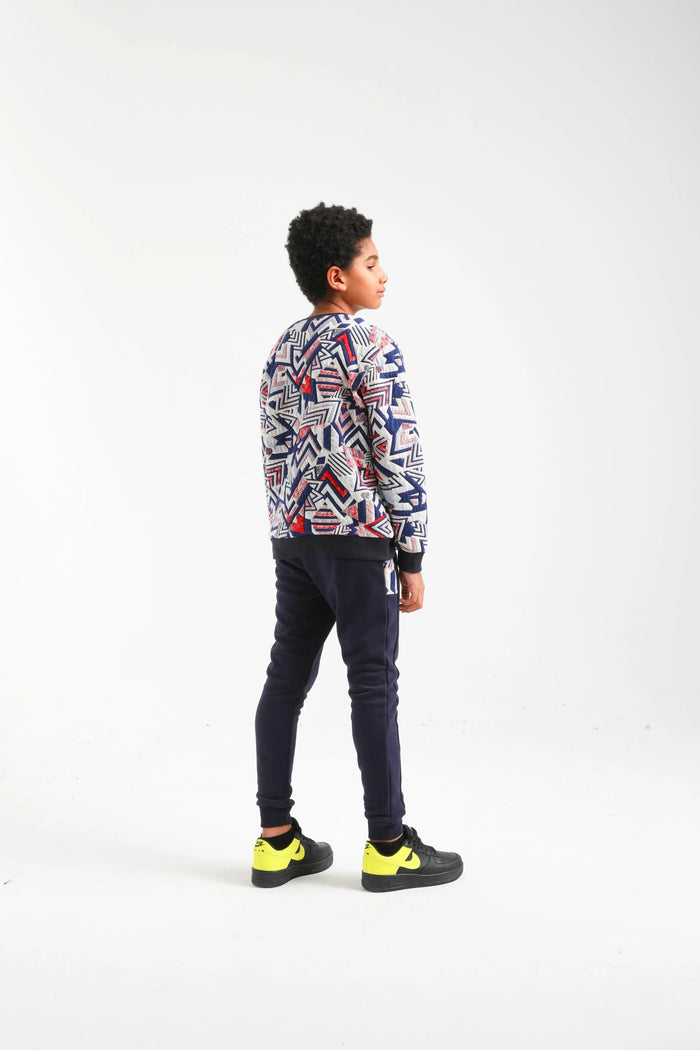 Boy modeling Nanica geometric sweatshirt set, back view