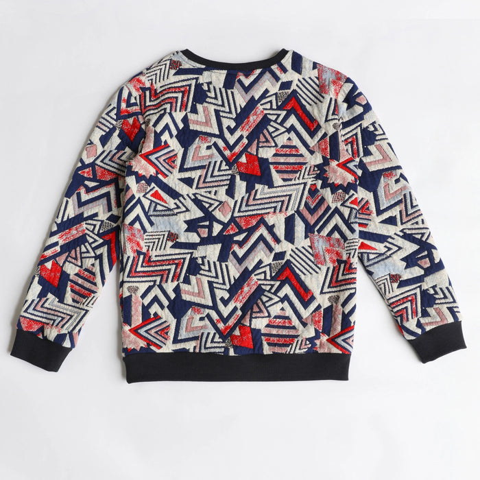 Nanica geometric-print boys sweatshirt with navy trim, back flat lay