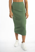 Nia ribbed sage green midi knit skirt for women with high-waist detailing and white sneakers.