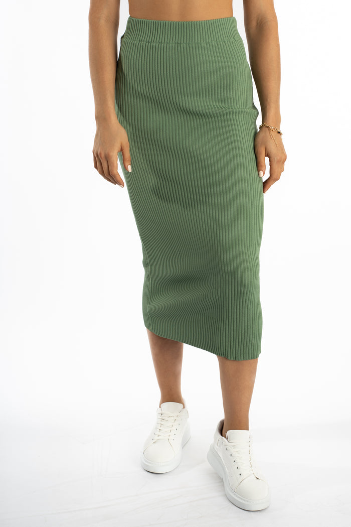 Nia ribbed sage green midi knit skirt for women with high-waist detailing and white sneakers.