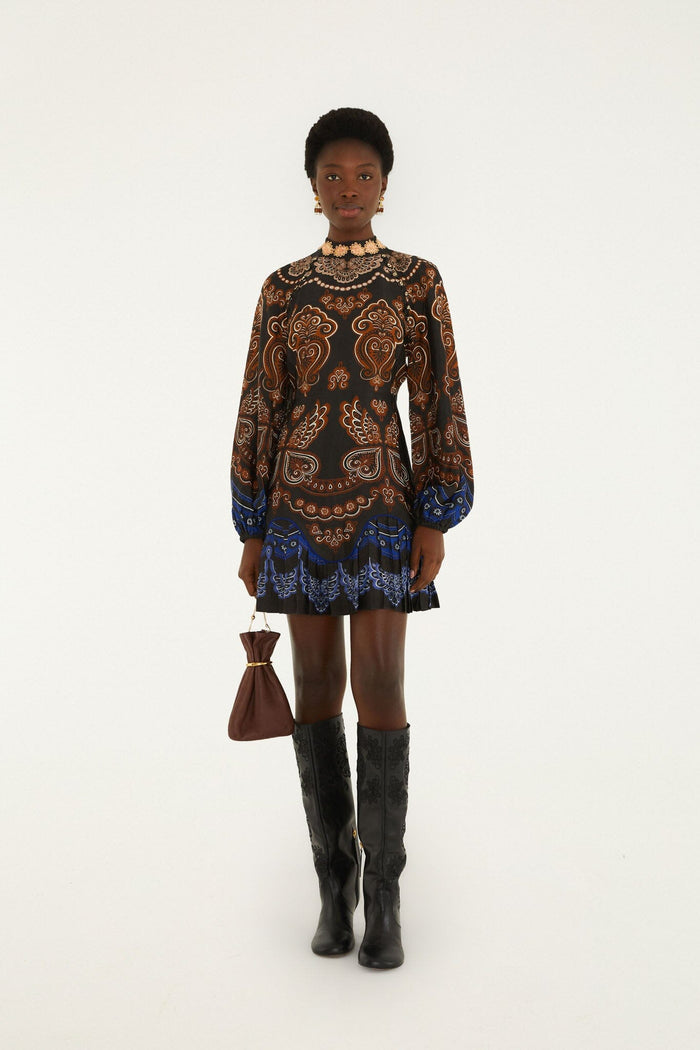 FARM Rio model wearing the Nicole Ruffled Long Sleeve Mini Dress