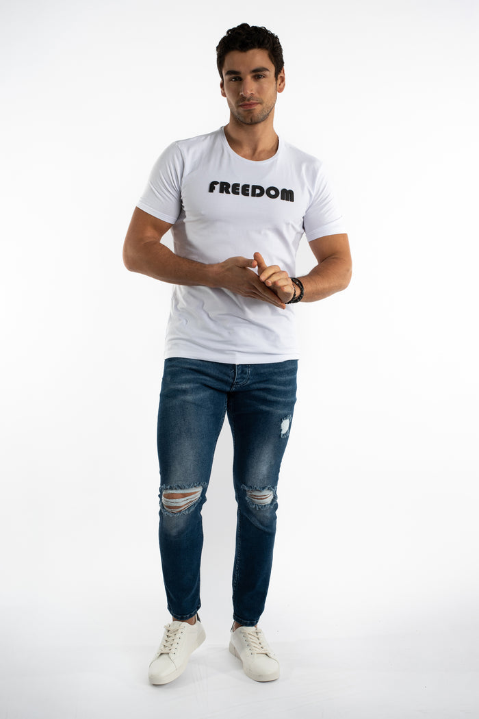 Men's Carbon Nixon slim fit blue distressed jeans with ripped knees and tapered leg in a streetwear style.