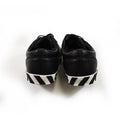 Rear view of Urban Edge Off-Sneakers in Carbon black leather with white soles featuring black diagonal streetwear stripes.