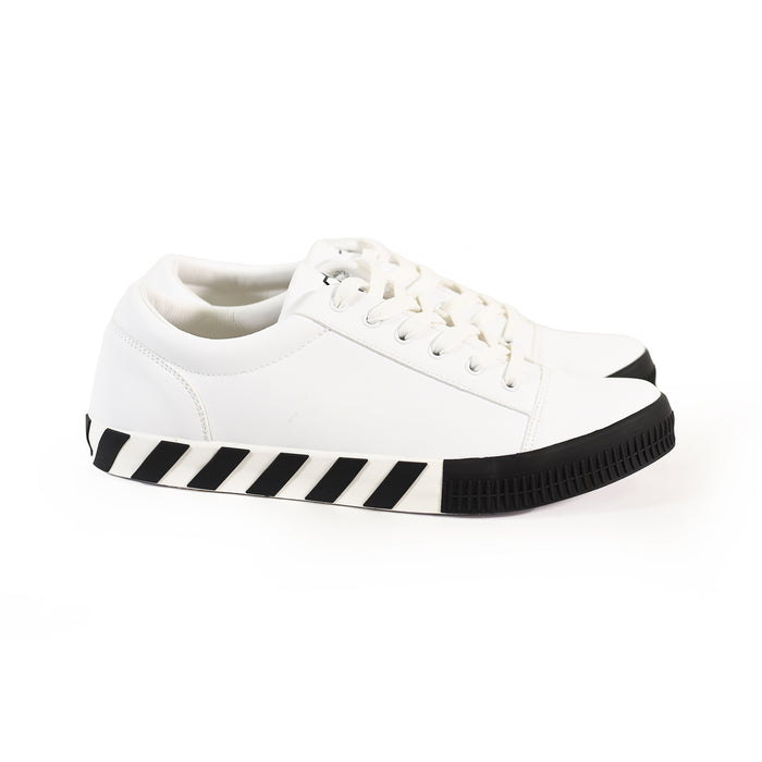 White Urban Edge Off-Sneakers featuring black diagonal striped soles and textured rubber toe caps for streetwear style.