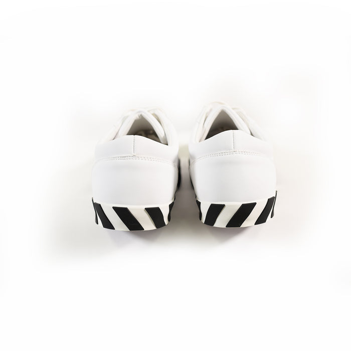 Rear view of Urban Edge Off-Sneakers in white featuring black diagonal striped soles for a streetwear aesthetic.