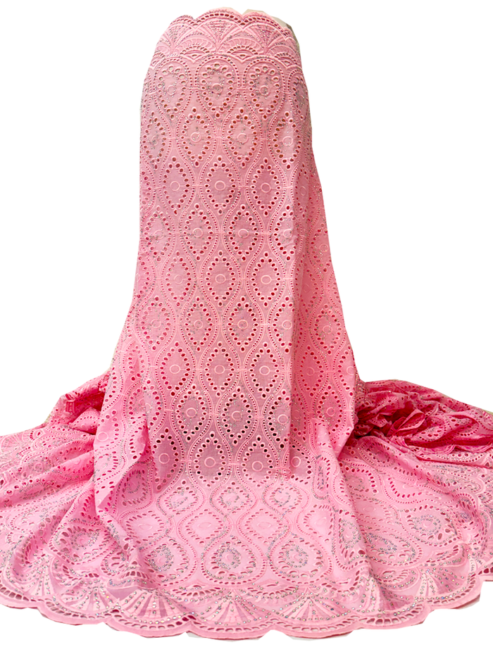 A piece of baby pink Swiss Voile lace fabric with a shiny stone pattern.