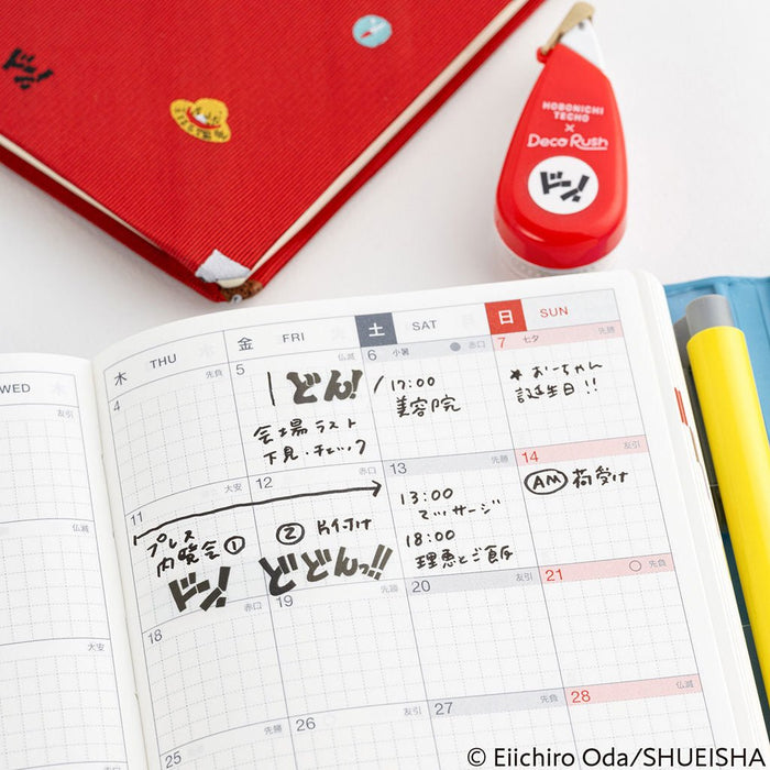 Planner calendar page with writing next to red Deco Rush tape dispenser
