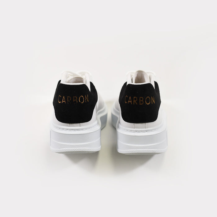 Rear view of Queen Platform Sneakers in white with black heel tabs, gold Carbon branding, and chunky streetwear soles.