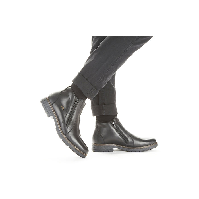 Men's black leather zip boots, side view, chunky tread sole