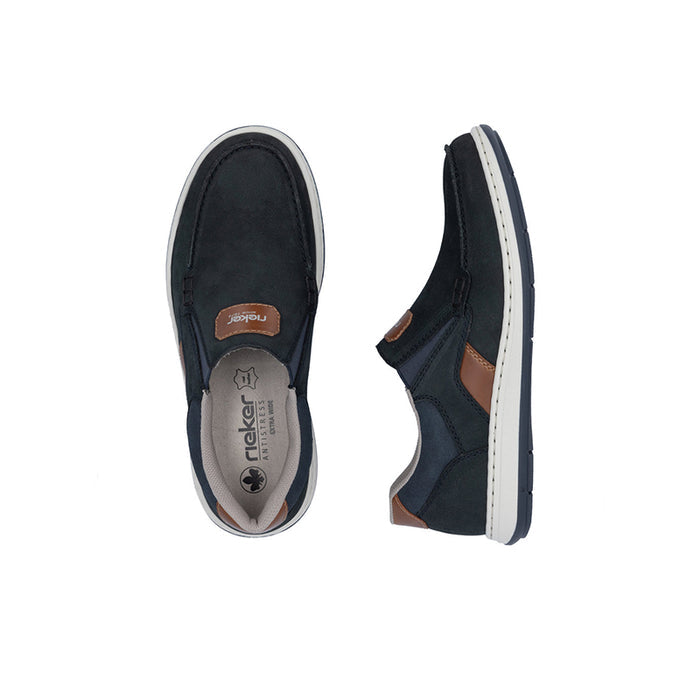 Men's dark blue slip-on sneakers showing inner sole label and side profile