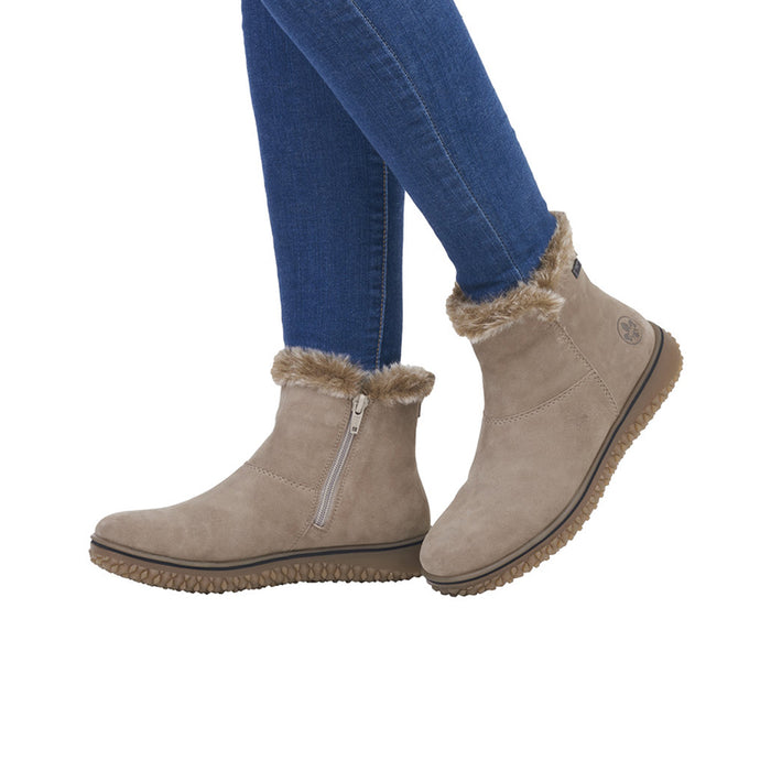 Beige suede ankle boots with faux-fur cuff and side zip, textured walking sole