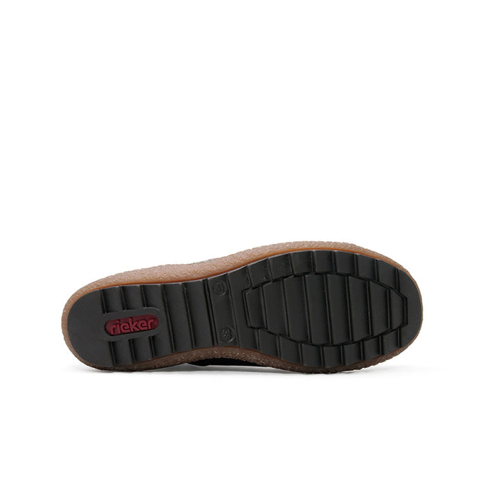 Ankle boot outsole with black rubber tread and tan leather heel trim