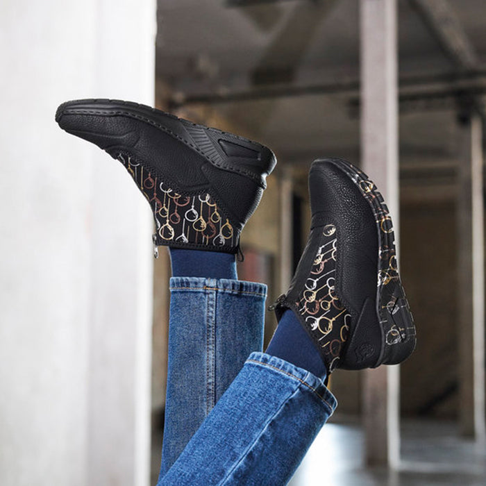 Women’s black ankle boots with gold-and-beige graphic side panels, low heel