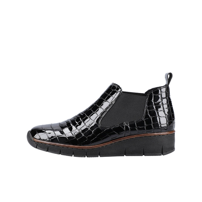 Black glossy slip-on ankle boot with crocodile print, side gore, and tread sole