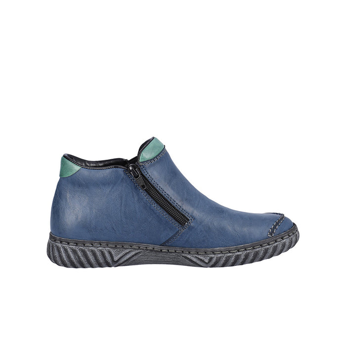 Women’s blue slip-on boots with side zipper, green collar, and grippy tread sole