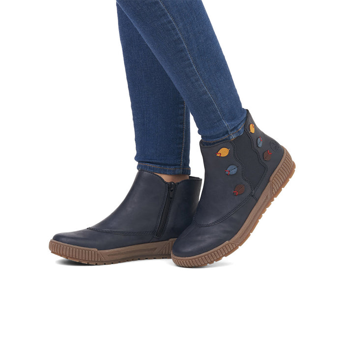 Women’s blue ankle boots with side zip, worn with blue jeans and cushioned sole