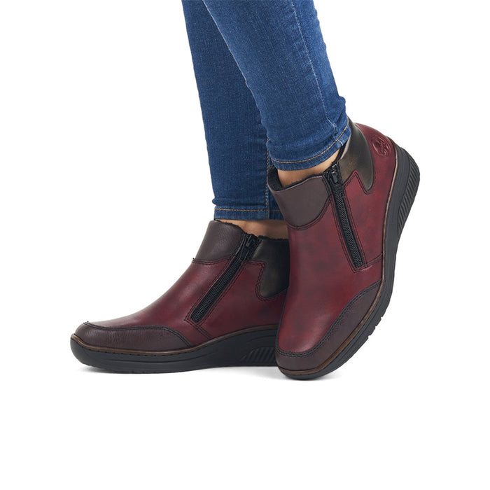 Dark red leather ankle boots on platform sole with side zipper